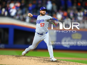 Los Angeles Dodgers relief pitcher Ryan Brasier #57 throws during the sixth inning in Game 3 of the baseball NL Championship Series against...