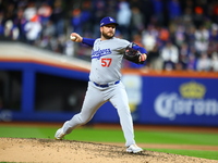 Los Angeles Dodgers relief pitcher Ryan Brasier #57 throws during the sixth inning in Game 3 of the baseball NL Championship Series against...