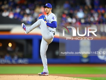 Los Angeles Dodgers starting pitcher Walker Buehler #21 throws during the first inning in Game 3 of the baseball NL Championship Series agai...