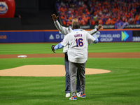 New York Mets Hall of Famer and 1986 World Series Champion Darryl Strawberry throws out the ceremonial first pitch to former teammate, fello...