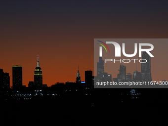 A sunset appears while looking towards Manhattan before Game 3 of a baseball NL Championship Series between the Los Angeles Dodgers and New...