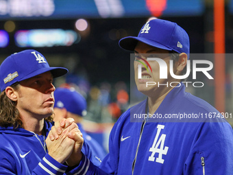 Shohei Ohtani #17 of the Los Angeles Dodgers celebrates their 9-0 victory in Game 3 of the baseball NL Championship Series against the New Y...