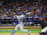 Tommy Edman #25 of the Los Angeles Dodgers breaks his bat during the fourth inning in Game 3 of the baseball NL Championship Series against...