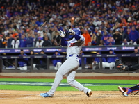 Teoscar Hernandez #37 of the Los Angeles Dodgers breaks his bat during the third inning in Game 3 of the baseball NL Championship Series aga...