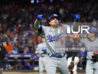 Enrique Hernandez #8 of the Los Angeles Dodgers gestures towards the stands after homering during the sixth inning in Game 3 of the baseball...