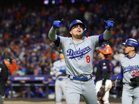 Enrique Hernandez #8 of the Los Angeles Dodgers gestures towards the stands after homering during the sixth inning in Game 3 of the baseball...