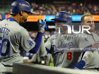 Enrique Hernandez #8 of the Los Angeles Dodgers celebrates with teammates after homering during the sixth inning in Game 3 of the baseball N...