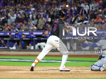 New York Mets' Starling Marte #6 is hit by a pitch during the third inning in Game 3 of the baseball NL Championship Series against the Los...