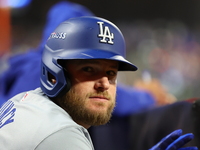 Max Muncy #13 of the Los Angeles Dodgers stands in the hole during the eighth inning in Game 3 of the baseball NL Championship Series agains...