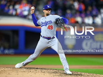 Los Angeles Dodgers relief pitcher Blake Treinen #49 throws during the eighth inning in Game 3 of the baseball NL Championship Series agains...