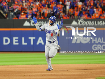 Enrique Hernandez #8 of the Los Angeles Dodgers rounds the bases after homering during the sixth inning in Game 3 of the baseball NL Champio...