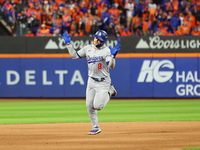 Enrique Hernandez #8 of the Los Angeles Dodgers rounds the bases after homering during the sixth inning in Game 3 of the baseball NL Champio...