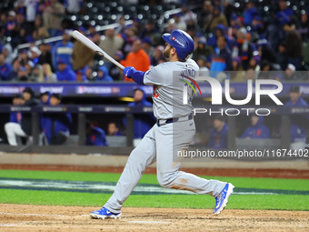 Max Muncy #13 of the Los Angeles Dodgers hits a home run during the ninth inning in Game 3 of the baseball NL Championship Series against th...