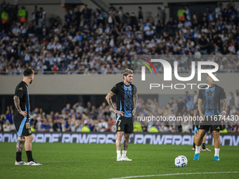 Lionel Messi, Rodrigo de Paul, and Lautaro Martinez of Argentina warm up before the FIFA World Cup 2026 Qualifier match between Argentina an...