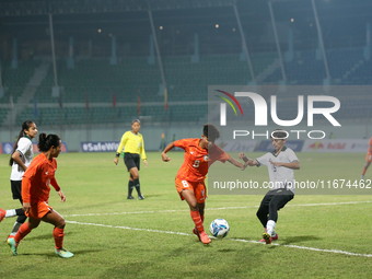 Players from India and Pakistan compete in the first-round match of the SAFF Women's Championship 2024 in Kathmandu, Nepal, on October 17, 2...