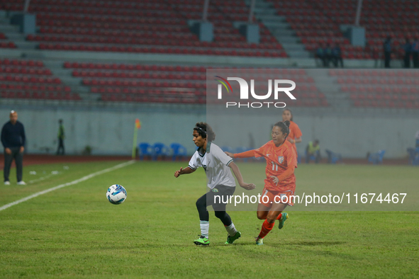 Players from India and Pakistan compete in the first-round match of the SAFF Women's Championship 2024 in Kathmandu, Nepal, on October 17, 2...