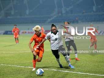 Players from India and Pakistan compete in the first-round match of the SAFF Women's Championship 2024 in Kathmandu, Nepal, on October 17, 2...