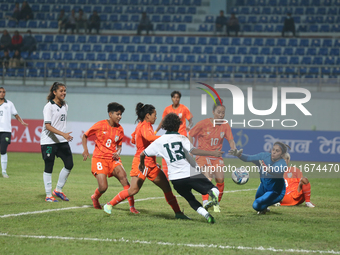 Players from India and Pakistan compete in the first-round match of the SAFF Women's Championship 2024 in Kathmandu, Nepal, on October 17, 2...