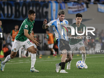 Rodrigo de Paul of Argentina and Gabriel Villamil and Jose Sagredo of Bolivia are in action during the FIFA World Cup 2026 Qualifier match b...