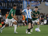 Rodrigo de Paul of Argentina and Gabriel Villamil and Jose Sagredo of Bolivia are in action during the FIFA World Cup 2026 Qualifier match b...