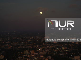 Hunter's Supermoon appears over the city of Colombo, Sri Lanka, on October 17, 2024. October's full moon is known as the Hunter's Moon becau...