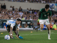 Enzo Fernandez of Argentina and Gabriel Villamil of Bolivia are in action during the FIFA World Cup 2026 Qualifier match between Argentina a...