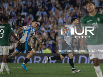 Lionel Messi and Enzo Fernandez of Argentina celebrate after scoring the sixth goal of their team during the FIFA World Cup 2026 Qualifier m...