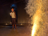 A child plays with light during the 'Deep Utsav or Light festival' before the Diwali festival in Feni, Bangladesh, on October 17, 2024. Diwa...