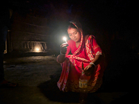 Bangladeshi Hindu people light oil lamps during the 'Deep Utsav or Light festival' before the Diwali festival in Feni, Bangladesh, on Octobe...