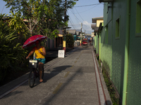 People ride bicycles on the streets of Afua, a city located at the mouth of the Amazon River, where it is forbidden to drive any type of mot...