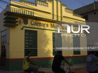 People ride bicycles on the streets of Afua, a city located at the mouth of the Amazon River, where it is forbidden to drive any type of mot...