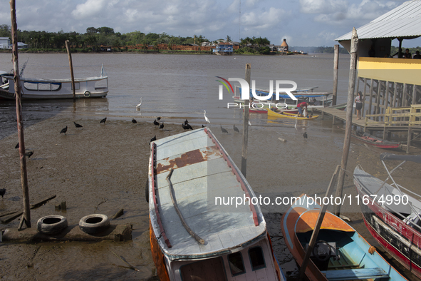 The Afua waterfront with boats during low tide in Afua, Para, Brazil, on September 29, 2024. 