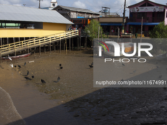 The Afua waterfront with boats during low tide in Afua, Para, Brazil, on September 29, 2024. (