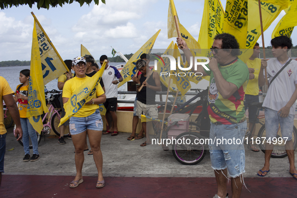 Supporters of Afua mayoral candidate Sandro Cunha walk in Afua, Para, Brazil, on September 29, 2024. 