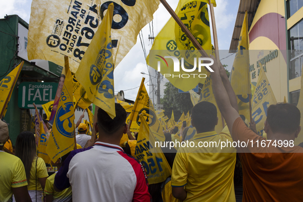 Supporters of Afua mayoral candidate Sandro Cunha walk in Afua, Para, Brazil, on September 29, 2024. 