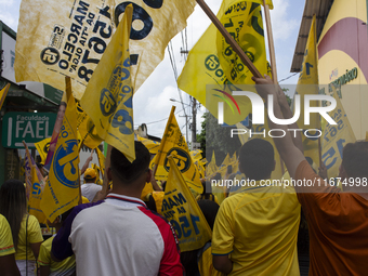 Supporters of Afua mayoral candidate Sandro Cunha walk in Afua, Para, Brazil, on September 29, 2024. (