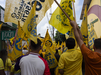 Supporters of Afua mayoral candidate Sandro Cunha walk in Afua, Para, Brazil, on September 29, 2024. (