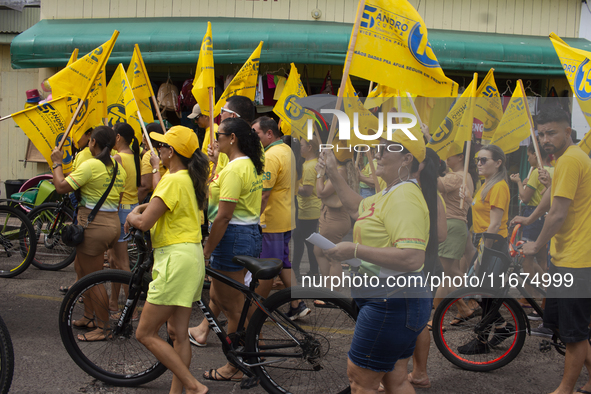 Supporters of Afua mayoral candidate Sandro Cunha walk in Afua, Para, Brazil, on September 29, 2024. 