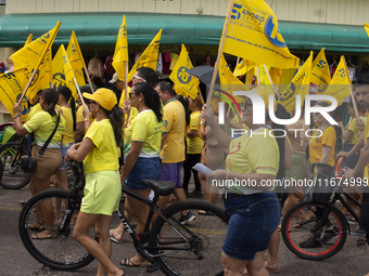 Supporters of Afua mayoral candidate Sandro Cunha walk in Afua, Para, Brazil, on September 29, 2024. (