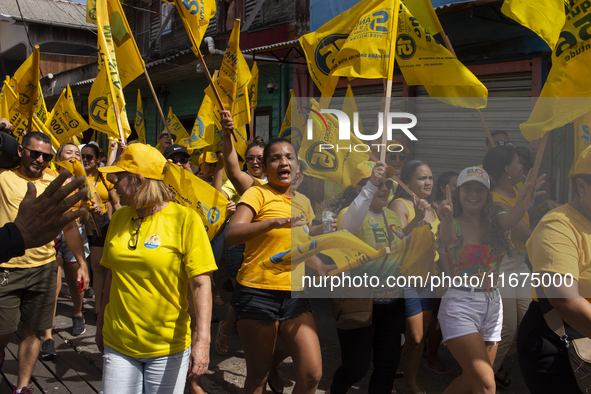 Supporters of Afua mayoral candidate Sandro Cunha walk in Afua, Para, Brazil, on September 29, 2024. 