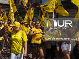 Supporters of Afua mayoral candidate Sandro Cunha walk in Afua, Para, Brazil, on September 29, 2024. (