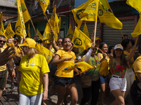 Supporters of Afua mayoral candidate Sandro Cunha walk in Afua, Para, Brazil, on September 29, 2024. (