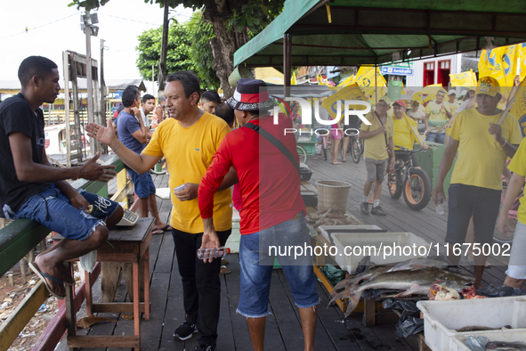 Supporters of Afua mayoral candidate Sandro Cunha walk in Afua, Para, Brazil, on September 29, 2024. 