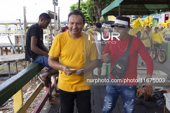 Supporters of Afua mayoral candidate Sandro Cunha walk in Afua, Para, Brazil, on September 29, 2024. 