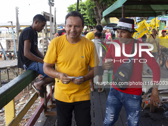 Supporters of Afua mayoral candidate Sandro Cunha walk in Afua, Para, Brazil, on September 29, 2024. (