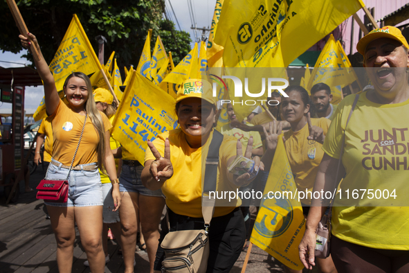 Supporters of Afua mayoral candidate Sandro Cunha walk in Afua, Para, Brazil, on September 29, 2024. 