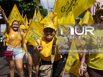 Supporters of Afua mayoral candidate Sandro Cunha walk in Afua, Para, Brazil, on September 29, 2024. (