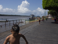 Children play at the municipal spa located at the mouth of the Amazon River in Afua, Para, Brazil, on September 29, 2024. (