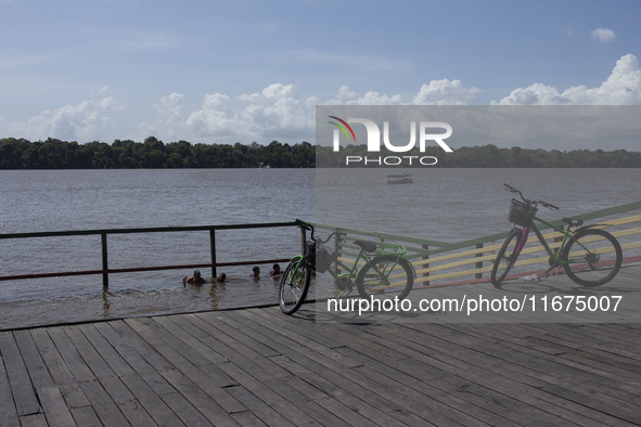 Children play at the municipal spa located at the mouth of the Amazon River in Afua, Para, Brazil, on September 29, 2024. 