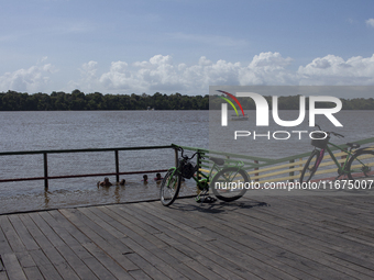 Children play at the municipal spa located at the mouth of the Amazon River in Afua, Para, Brazil, on September 29, 2024. (